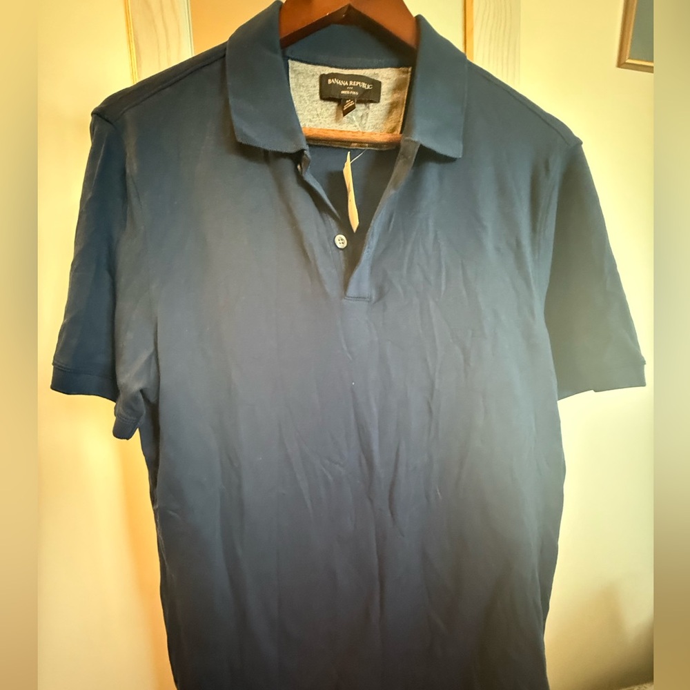 Banana Republic Deep Blue Polo Shirt. new with tags.